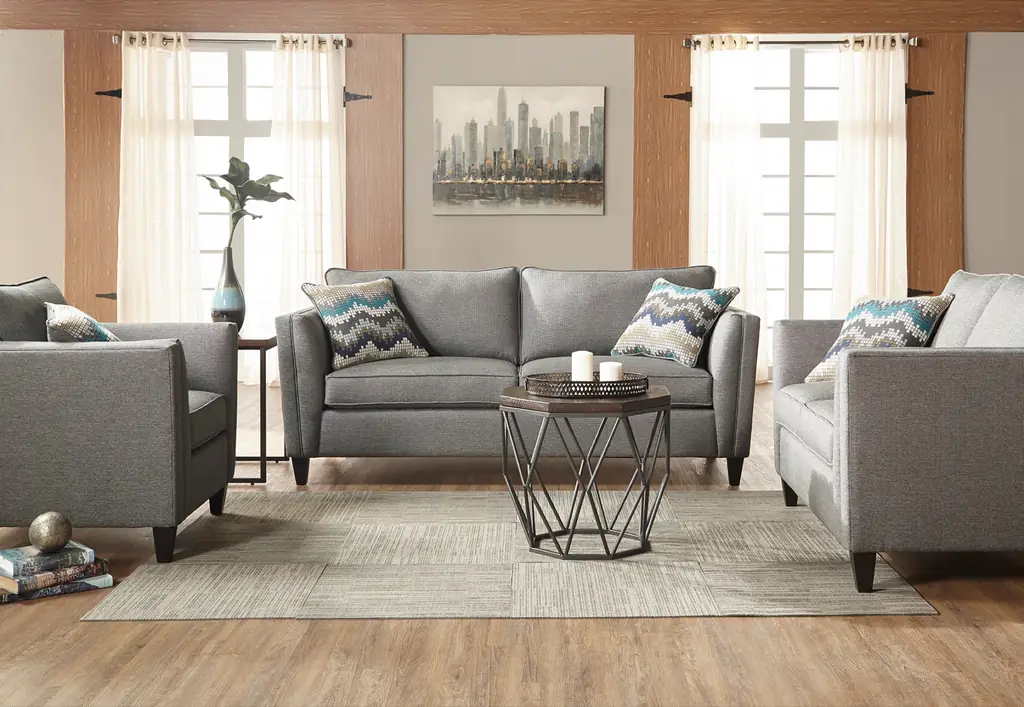 Grey mid-century sofa and armchairs around a hexagonal metal coffee table